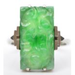 An Art Deco 9ct white gold and carved jadeite panel ring, 19 x 11mm, N, 3.7gm.