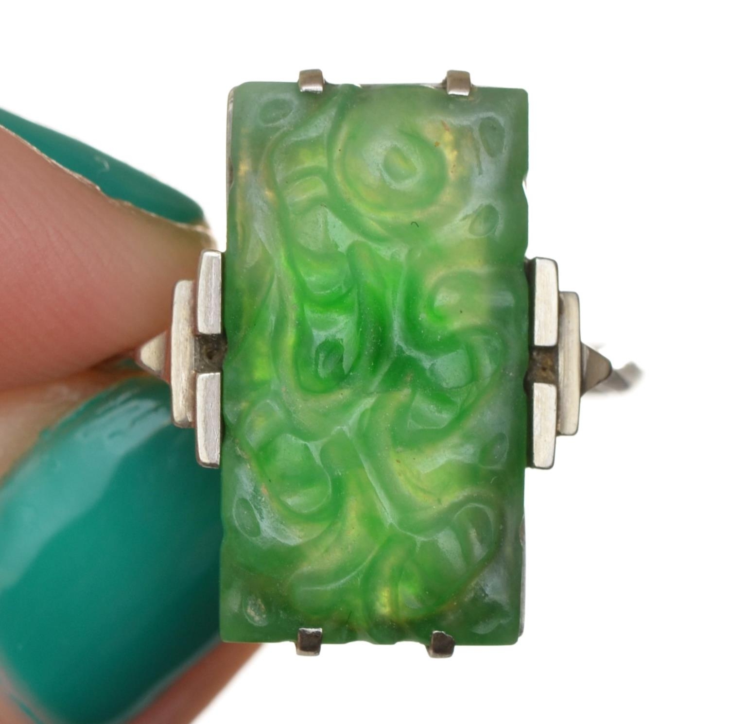 An Art Deco 9ct white gold and carved jadeite panel ring, 19 x 11mm, N, 3.7gm. - Image 4 of 4