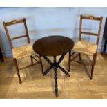 A late Victorian gypsy table, the plain round top above an ebonised tripod base with turned