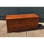 A stained pine chest, hinged top, 105 x 44 x 38cm