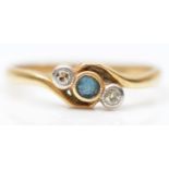 An 18ct gold sapphire and diamond three stone ring, L 1/2, 1.9gm