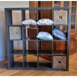A contemporary grey storage unit of 4 over 4 compartments, 150 x 150 x 40cm