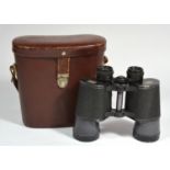 A pair of Carl Zeiss Jenoptem 10x50 binoculars, stamped 4869089, in a leather case