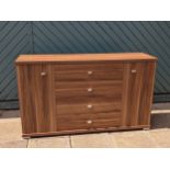 A contemporary dining rom suite by Julian Bowen, consisting of a sideboard, four central drawers