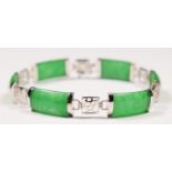 A Chinese 14K white gold and jade panel link bracelet, untested for colour enhancement, 18cm, 11gm.