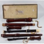 A Schott's wooden concert bass recorder, together with a Dolonte tenor recorder and two Aulos