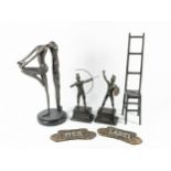 A bronzed Art Deco style female figurine, 36cm tall, together with a pair of bronzed warrior statues