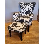 A faux pony skin armchair with foot stool