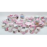 A large collection of early 20th century souvenir lustreware pottery pieces, to include teapots,
