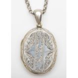 A Victorian oval silver back and front locket, 37 x 28mm, 28.7gm on later chain,
