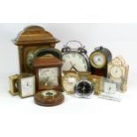 A collection of mid 20th century and later mantel clocks, carriage clocks and barometers, having