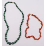 A malachite graduate bead necklace, 14 - 7mm, 56cm and a coral necklace, 42cm (2).
