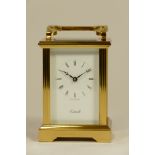 An English brass carriage clock, with a jewelled 8 day movement, boxed. 12cm tall.