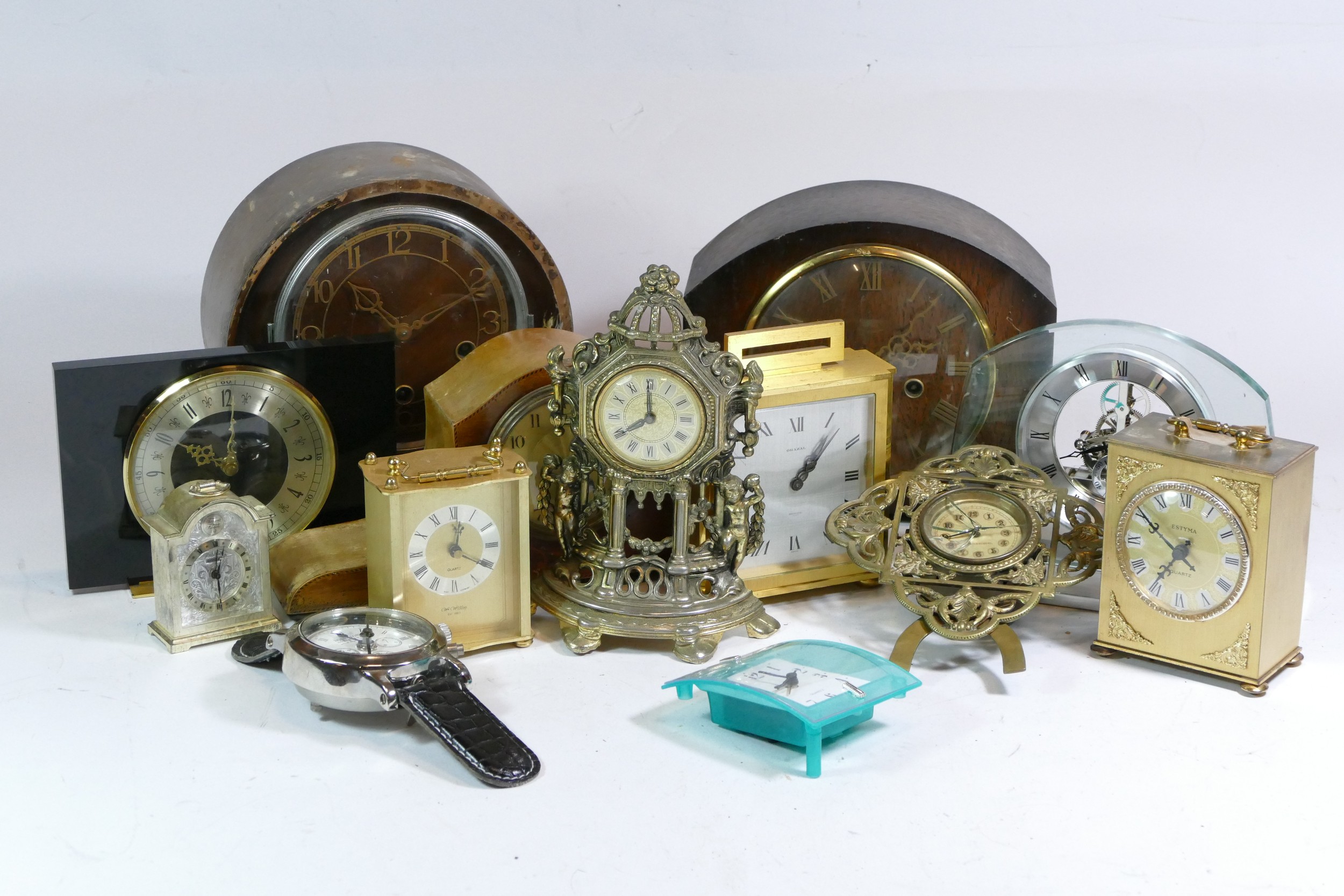 A collection of mid 20th century and later mantel clocks, having manual wind and quartz movements,