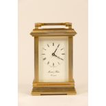 A mid 20th century English carriage clock, brass case with jewelled 8 day movement stamped Made In