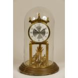 A 1960s German Kundo 400 day anniversary clock, having stepped brass base with glass dome. H30cm.