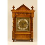 An early 20th century mahogany cased mantel clock, having architectural pediment with corinthium