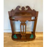 An Edwardian oak hall/umbrella stand, with wunder flap storage and twin metal drip trays. W76,