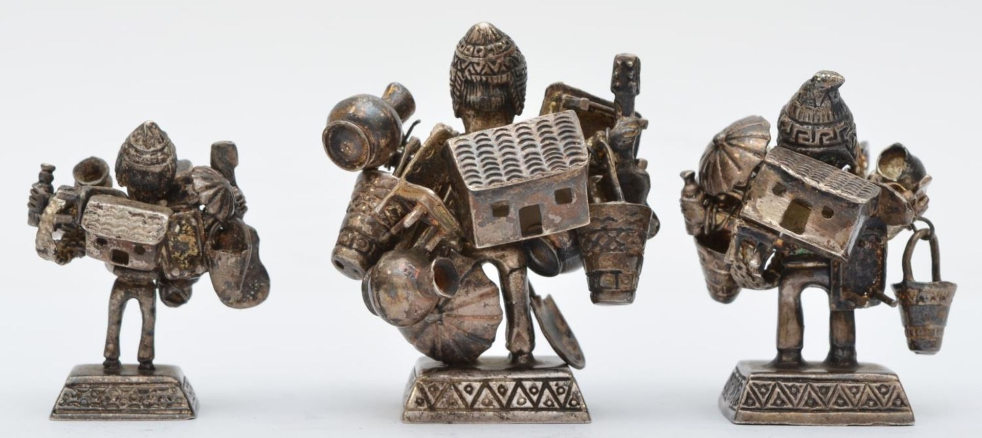 Three silver peddler figures, stamped 925, with loose hung wares, the largest 6cm, 163gm - Image 2 of 2