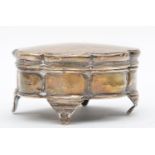 A silver trinket box, Birmingham 1921, of lobed form,, raised on four feet, 7.5cm.