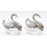 A silver mounted pair of glass swan salts, London import 1971, with articulated wings, 7cm.