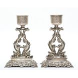 A Chinese pair of silver candlesticks, by Hung Chong, Canton and Shanghai, c.1880-1890, composed