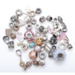 45 branded assorted silver charms, 93g.