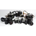 Six 35mm film cameras, with lens, to include a Canon EOS 3000, a Praktica LTL-3, a Canon EOS1000F N,