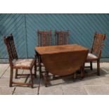 A drop leaf dining table, on barley twist legs, 107 x 130 x 50cm (leaves up), together with four