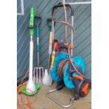 A Gardena hose trolley with hosepipe, together with a garden electric strimmer and stainless steel