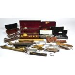 A collection of measuring devices, to include slide rules, callipers, gauges, balances and more