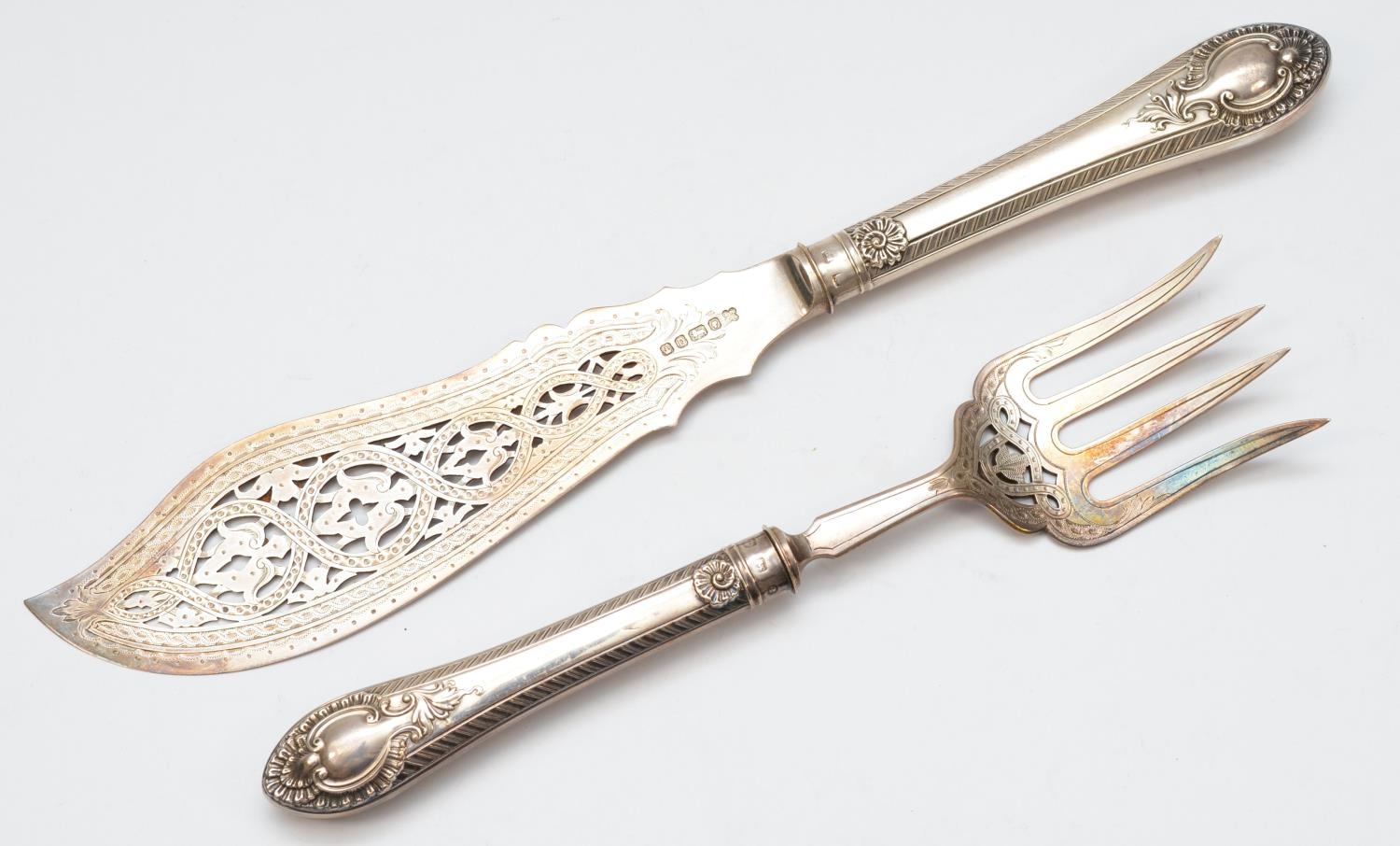 A Victorian pair of silver fish servers, Sheffield 1847, with pierced blades, loaded handles, cased - Image 2 of 3