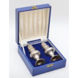 A silver pair of baluster salt and pepper castors, Birmingham 1978, in the George III style, 14.5cm,