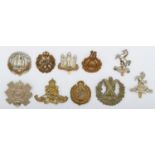 A collection of 10 military cap badges, to include Cameron and Royal Marines.