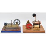 Two live steam models, both presented on wooden bases, both in the form of pistons, brass
