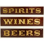 Three mahogany decorative shop signs, "Beer" "Wine" "Spirits", decorated with hand painted gilt