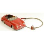 A Distler Electromatic 7500 tinplate car, made in West Germany, in the form of a Porsche, red,