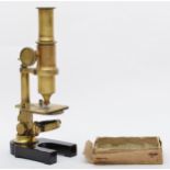 A brass microscope, unnamed, with optic, also include several blank glass slides