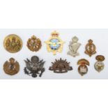 A collection of 10 military cap badges, to include American and Irish
