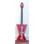 A Dean Guitars electric guitar, bow tie shaped body, in cheery red colourway with Budweiser