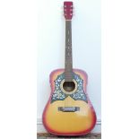 A unbranded acoustic guitar, model No K235, sunburst colourway with twin scratch guards, decorated