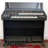 A Technics SX EX 30 electronic organ, with stool and manual, together with a collection of sheet