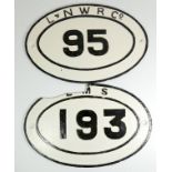 Two oval cast iron bridge plates, 'L.N.W.R. Co. 95' and 'L.M.S. 193'. (2)