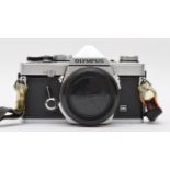 A Olympus OM-1 MD 35mm film camera, body only, with manual, working