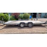 A Brian James twin axel car trailer, 1600kg load, with pull out ramps and locking tow hitch with