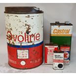 An Ovoline 5 gallon can, Castrol 1 gallon can and three other cans