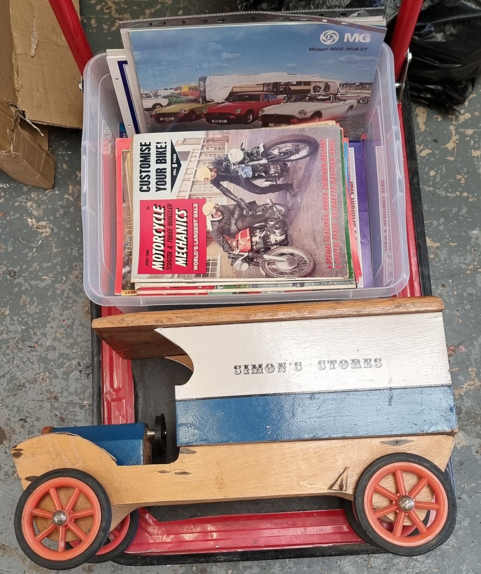 A wooden Simon's Stores promotional lorry and various magazines