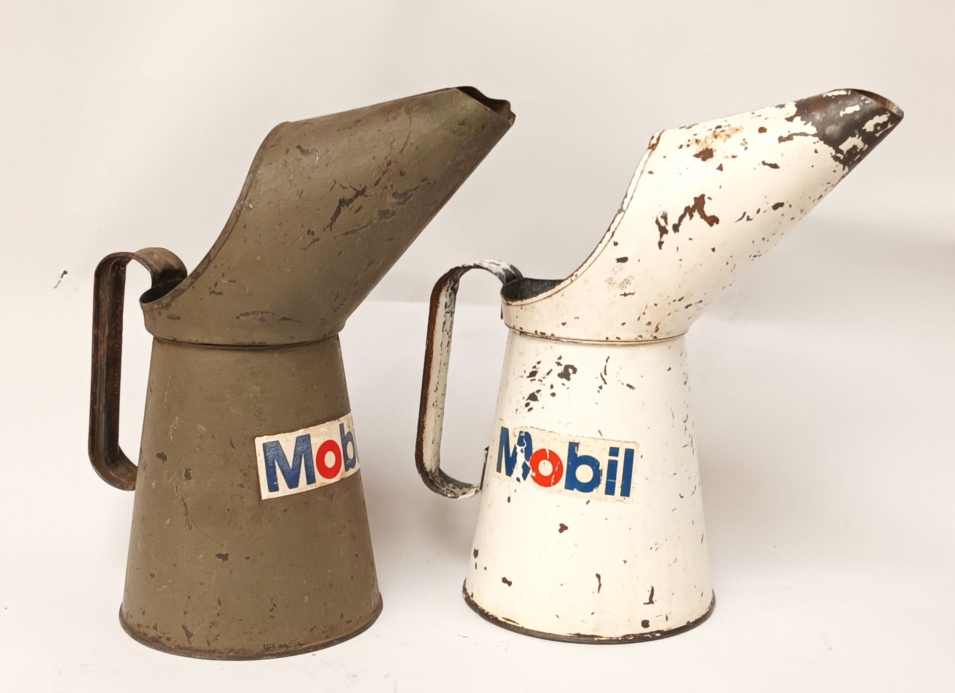 Two Mobil quart oil jugs
