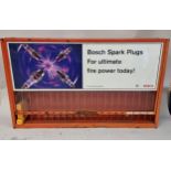 A Bosch spark plug wall mounted display stand, 67 x 11 x 40cm