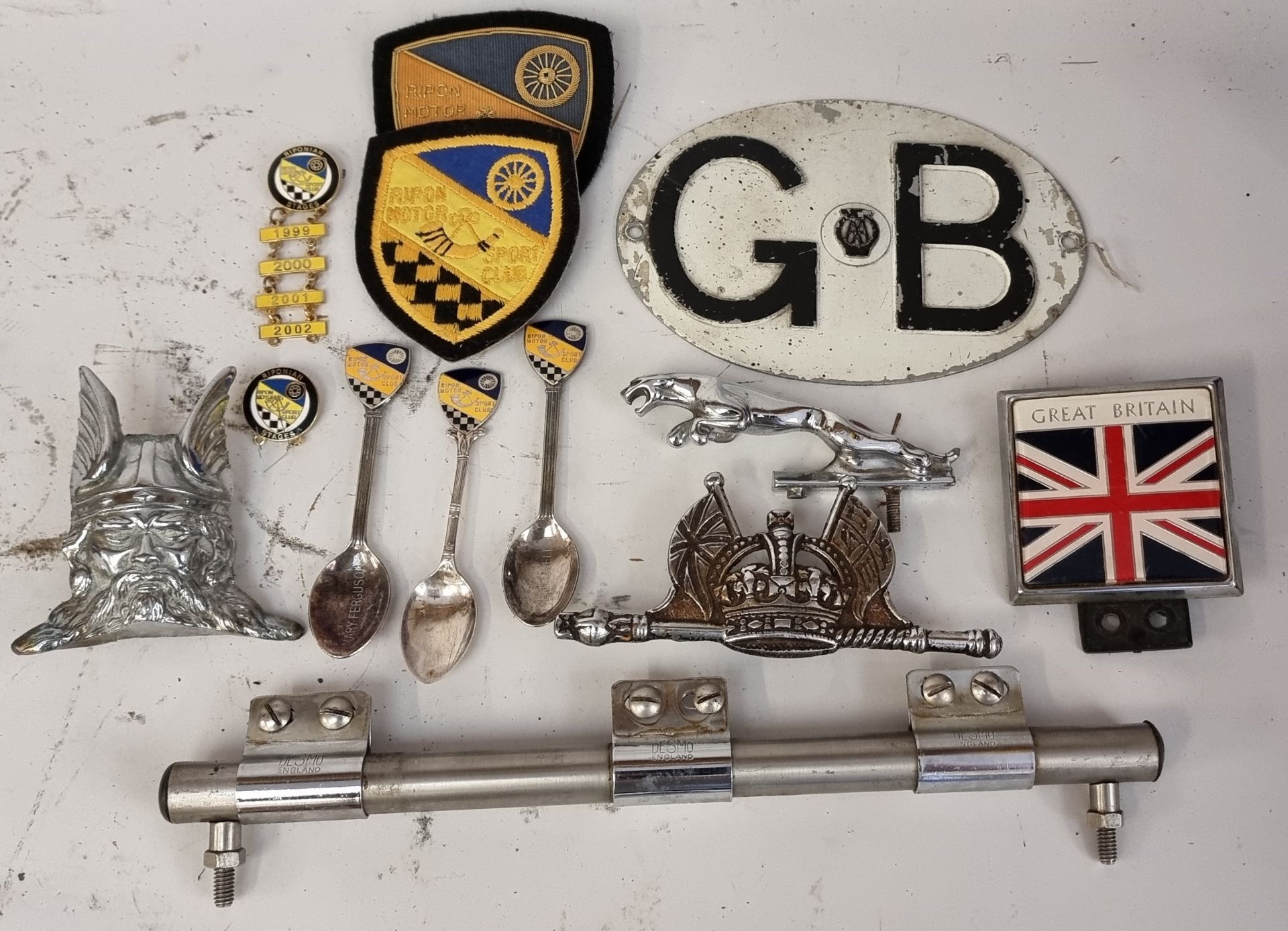 A Jaguar leaping cat mascot and other motoring artefacts